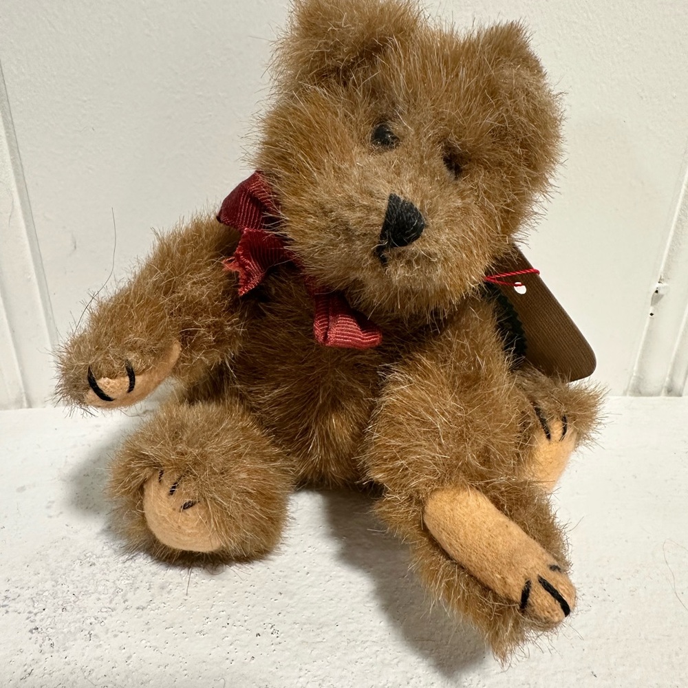 Boyd’s Brown Teddy Bear with Red Bow. Still has tag with Boyd’s info printed.